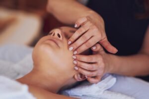 Woman having japan style face massage in salon
